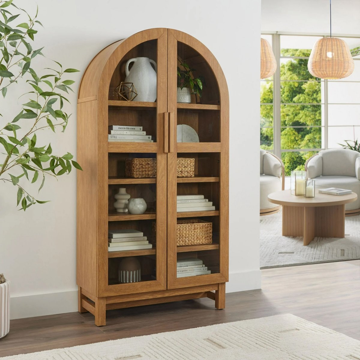 Better Homes and Gardens arched cabinet in a light honey finish