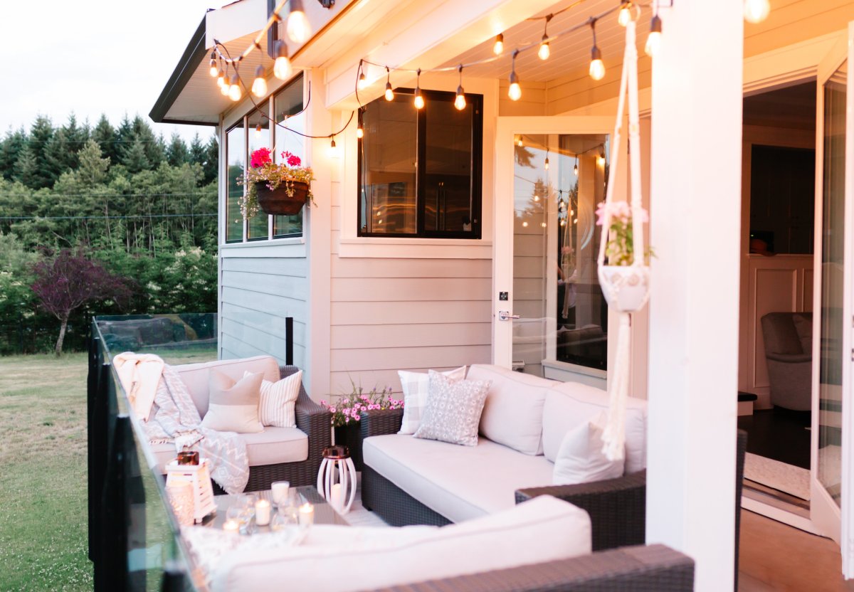 Outdoor deck lit up with with string lights