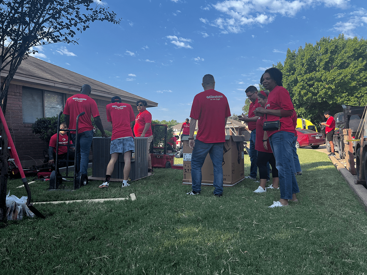 Volunteers with Lennox Feel the Love program installing HVAC system in a home of deserving community members.