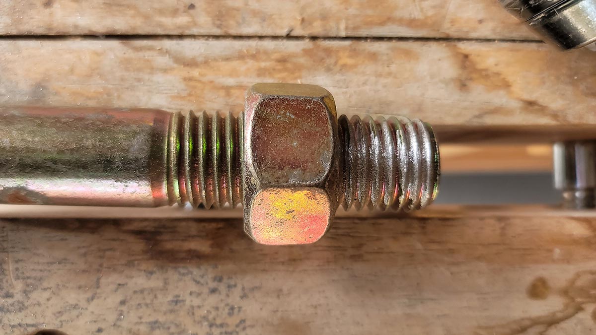 Nut fits on restored bolt after the thread is fixed