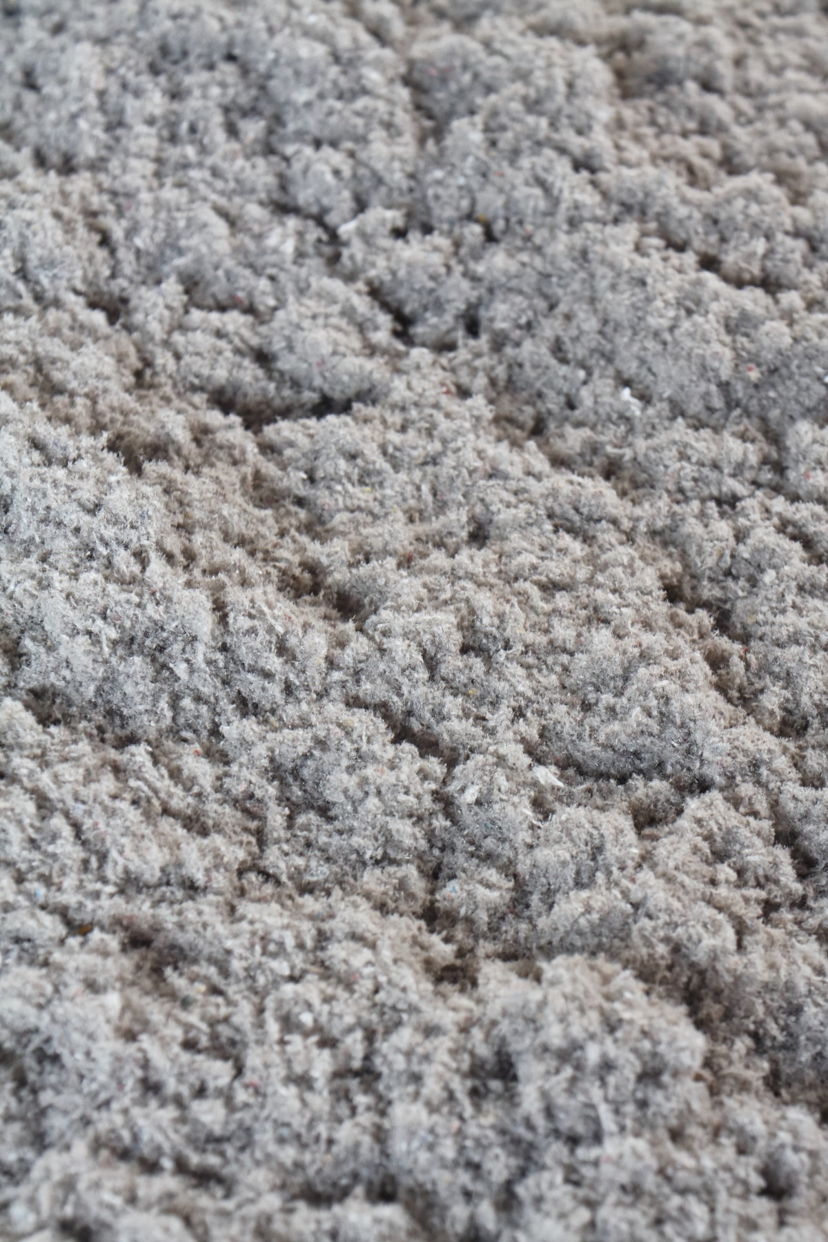 Close up of recycled paper cellulose insulation.