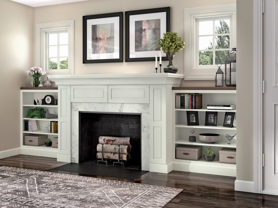 Small white built-in bookshelves on either side of a white fireplace in a living room.