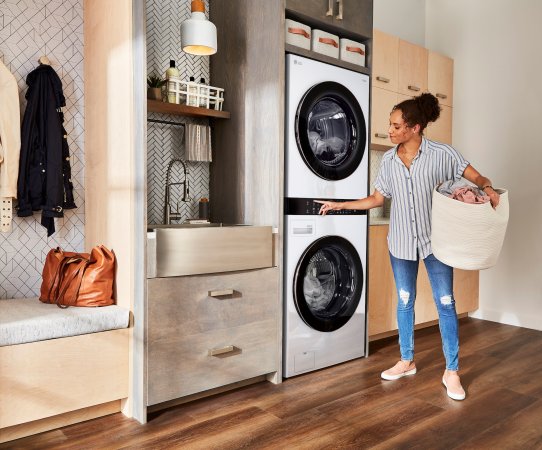 Woman doing laundry with the LG WashTower