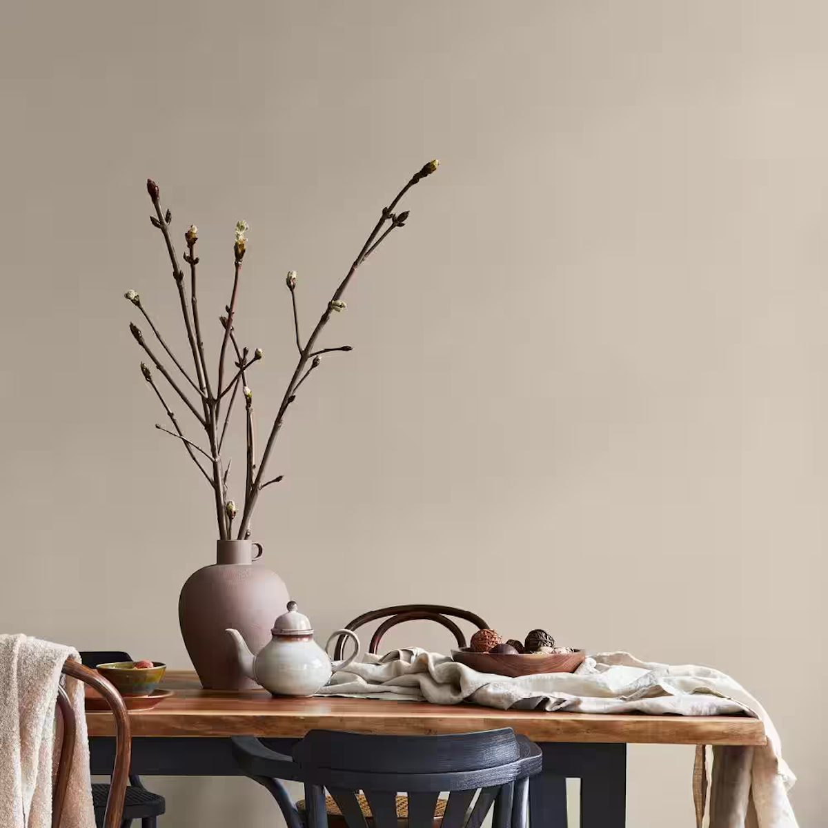 PPG Paints' Stonehenge Greige neutral paint color on a dining room wall.