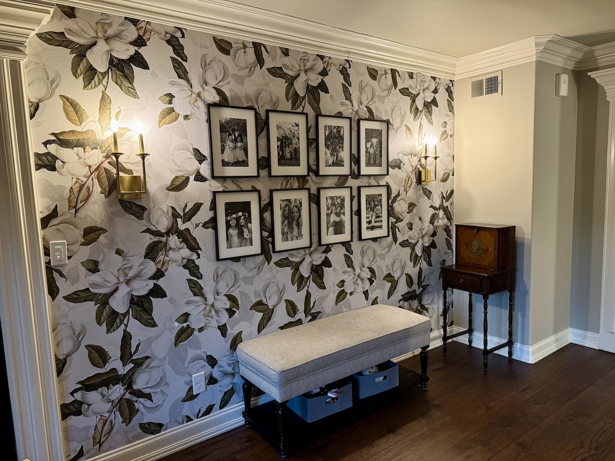 Peel-and-stick floral wallpaper installed in a hallway.