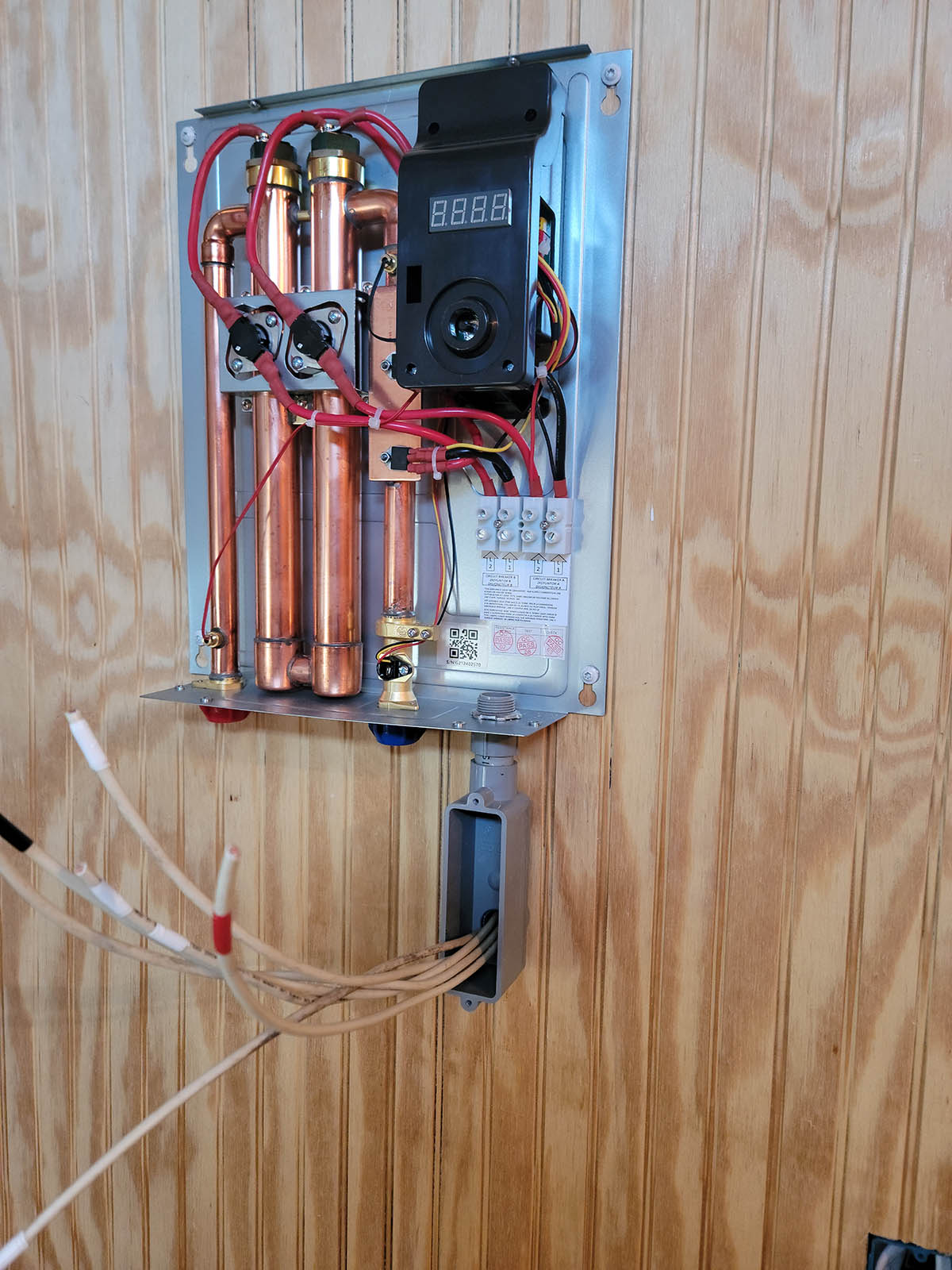 Rheem Water Heater Review Showing wire originating from other side of wall