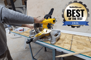 Best power tool and DIY essentials for 2024, person using a dewalt miter saw