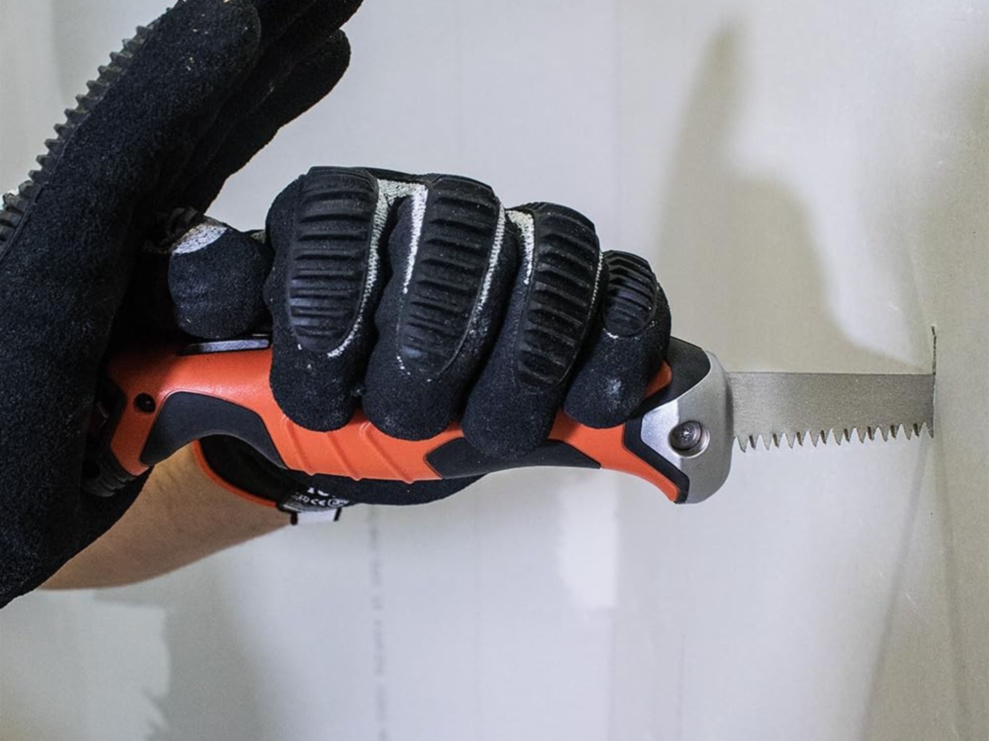 A man working with one of the Best Drywalls Saws Option