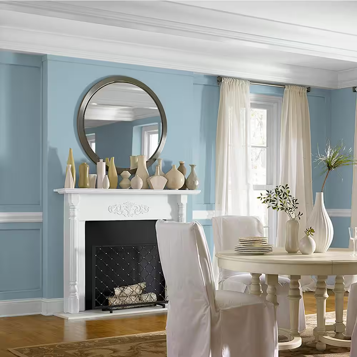 Behr peaceful blue neutral paint color on a wall with a fireplace.