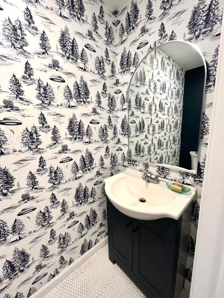 Peel-and-stick wallpaper installed in a powder room bathroom.