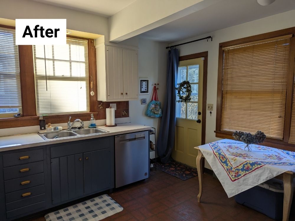 In the current stage of my "slow reno," the kitchen feels larger mostly thanks to painting the uppers to match the white walls.