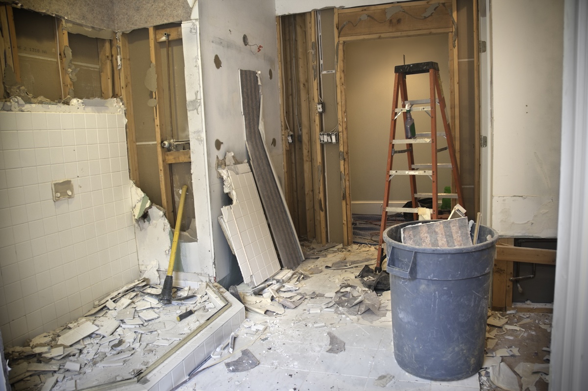 Renovation with open walls to see plumbing pipes and electrical wires.