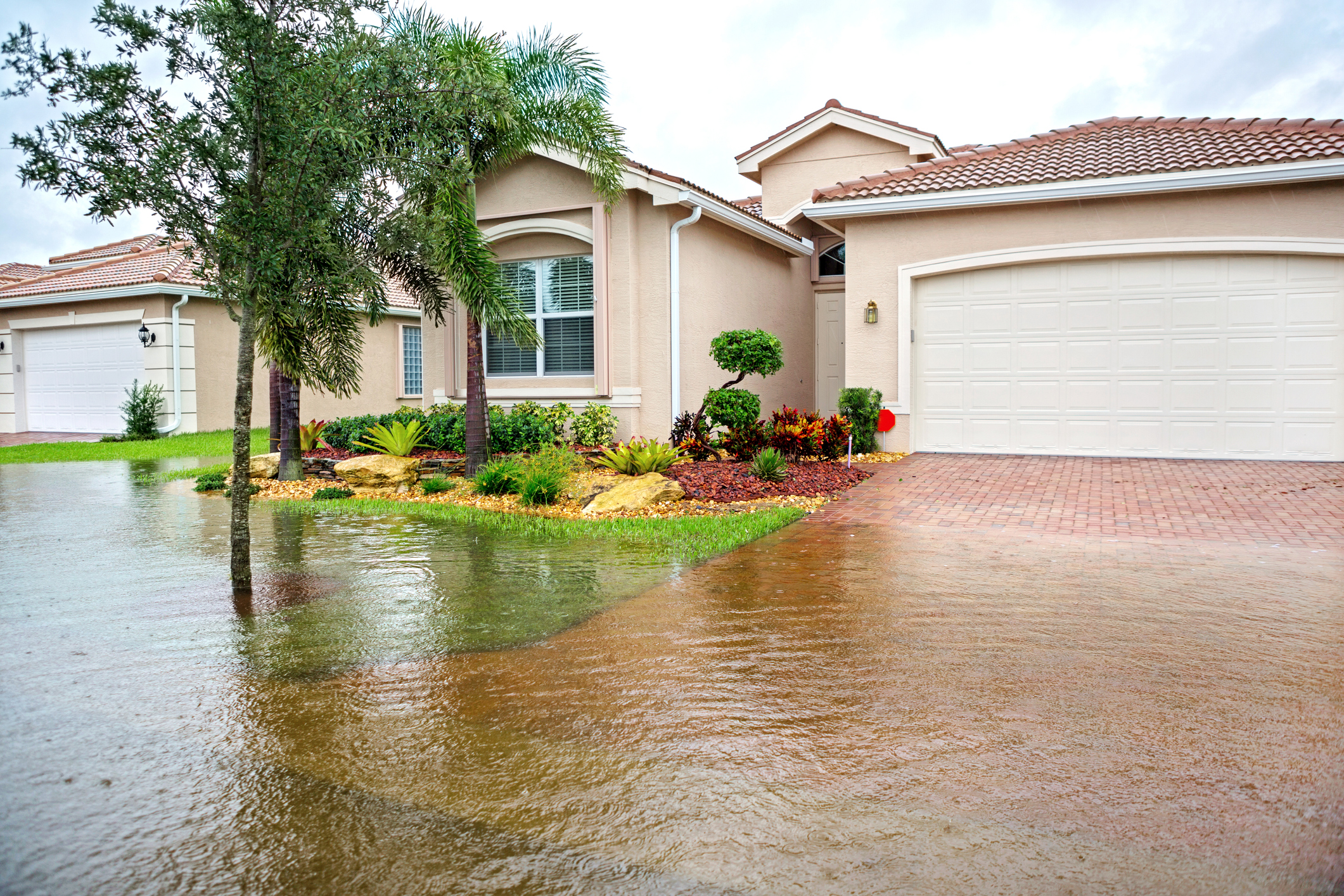 Flooding in front of a house from a hurricane or tropical storm