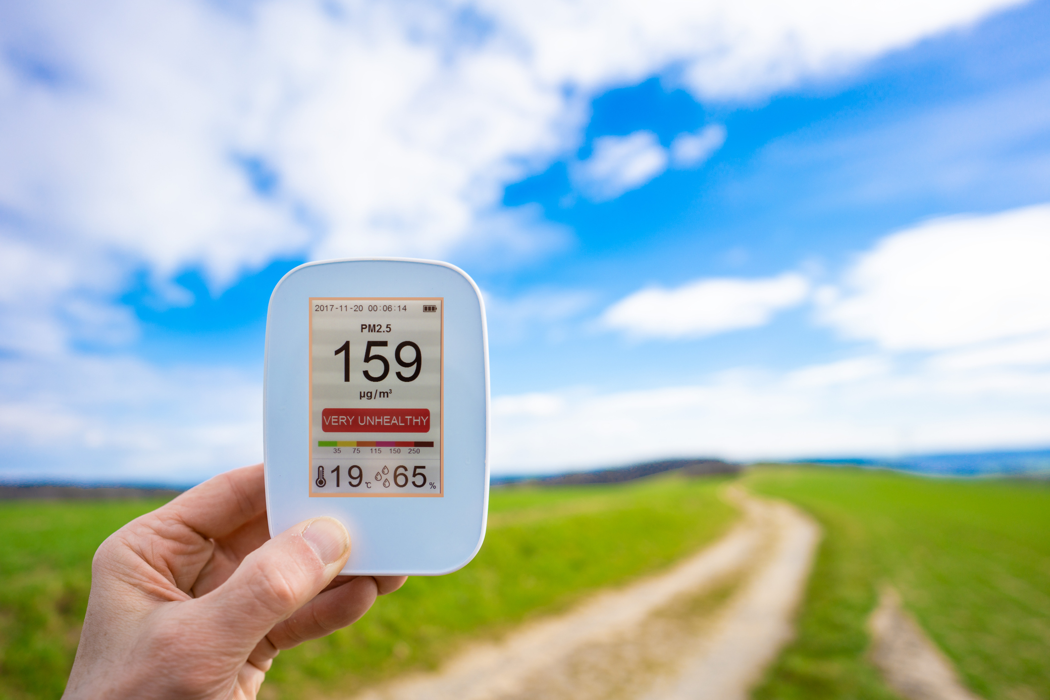 Hand holding air quality monitor