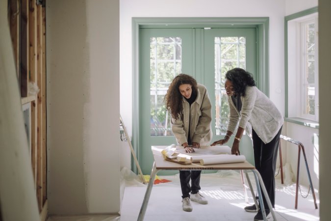 A homeowner and a designer discussing a renovation project.