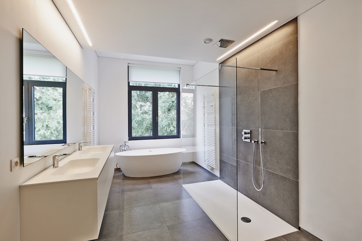 An example of a primary or master bathroom layout with a freestanding tub and walk in shower.