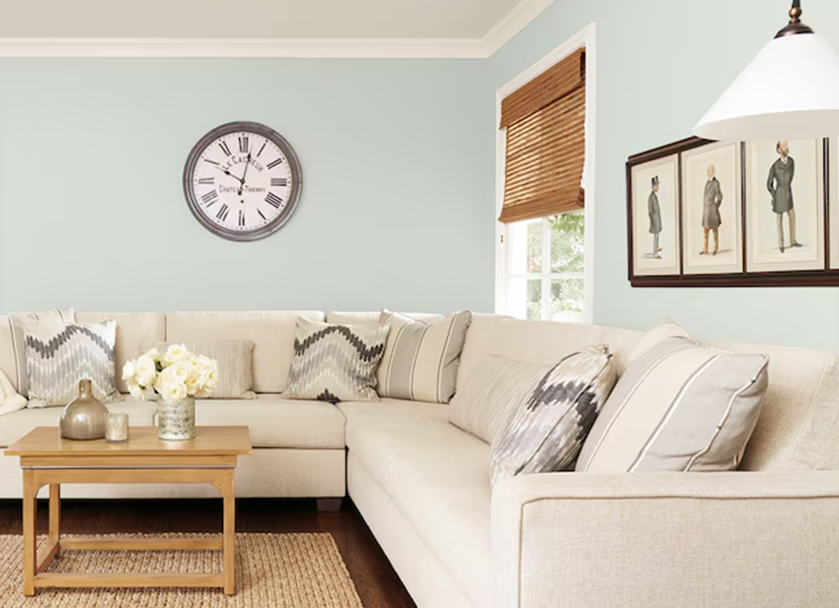 A living room painted in Sherwin-Williams Sea Salt, one of the best green paint colors of 2025.