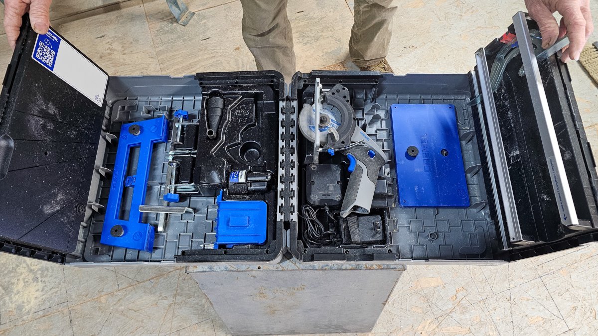 Tools and accessories stowed in the case of the Dremel Blueprint Portable Saw Station