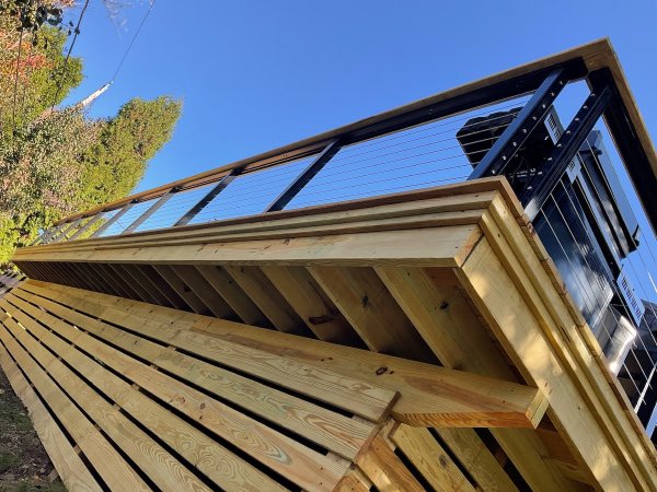 The underside of a deck with a critter wall after cleaning.