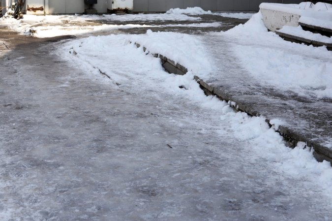 Ice building on driveway and walkway