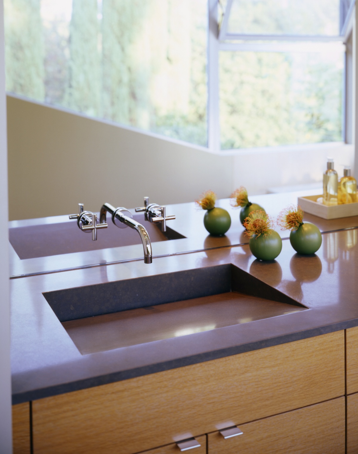 A purple solid surface sink and countertop in a home bathroom.