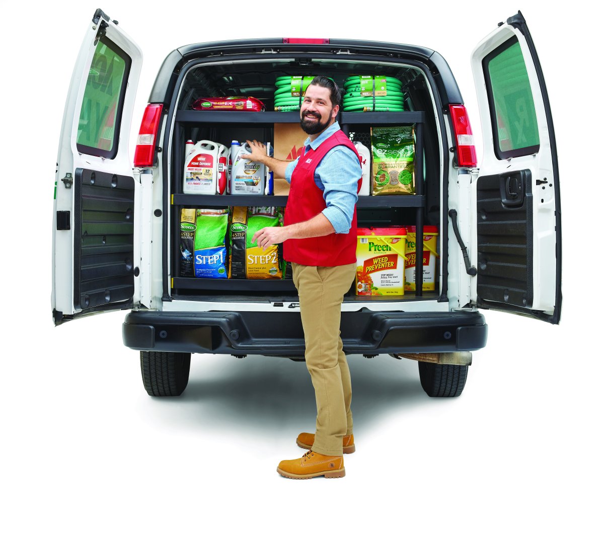 Ace Hardware YardRx truck loaded with supplies with man standing next to it