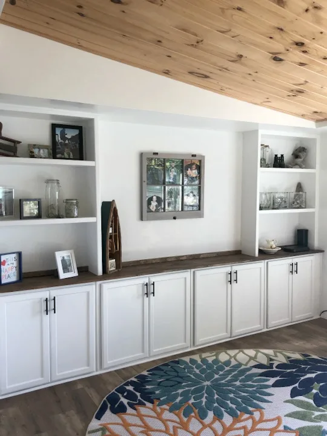 Built-in cabinets along a living room wall.