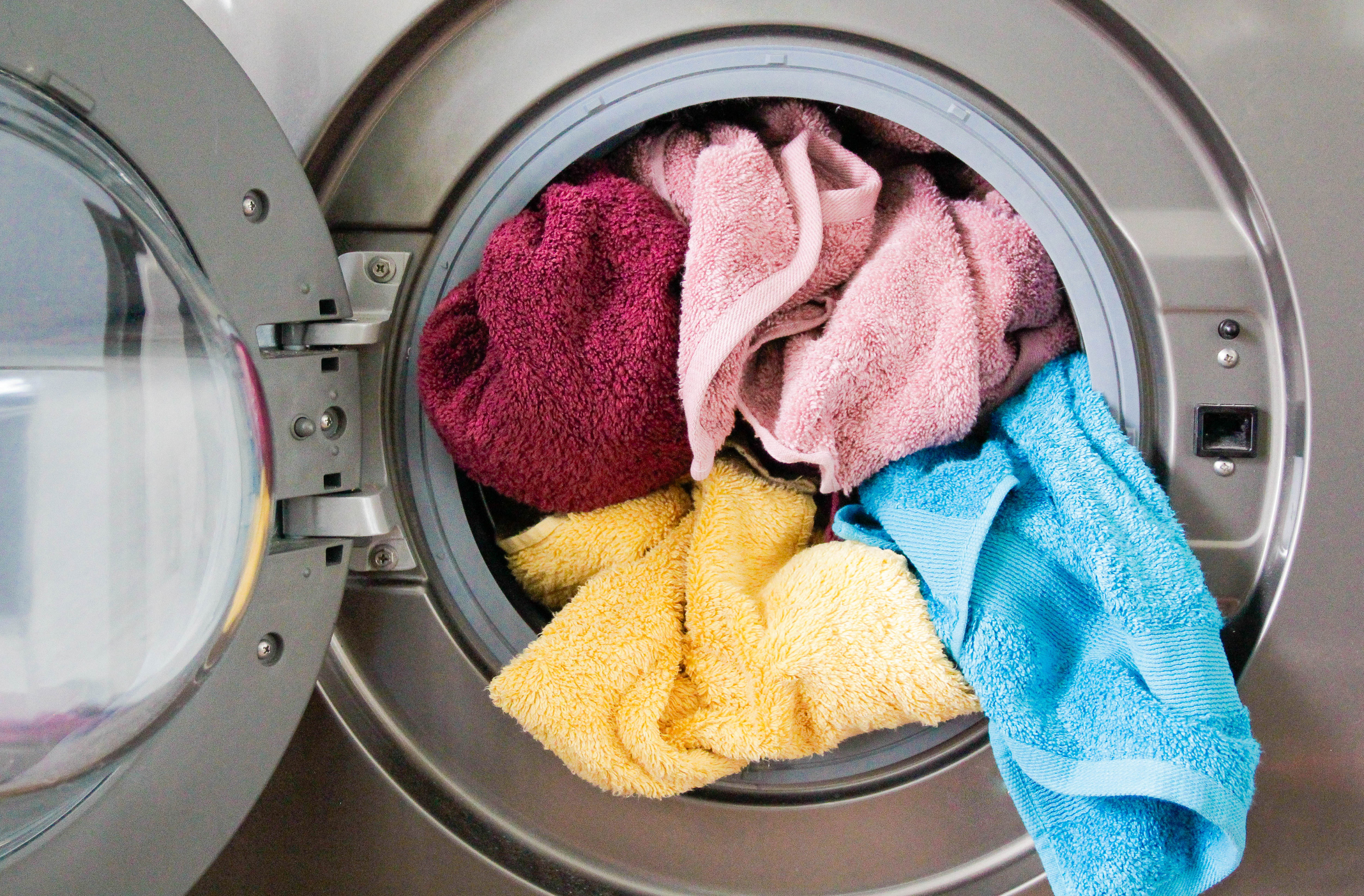 Colorful towels in dryer