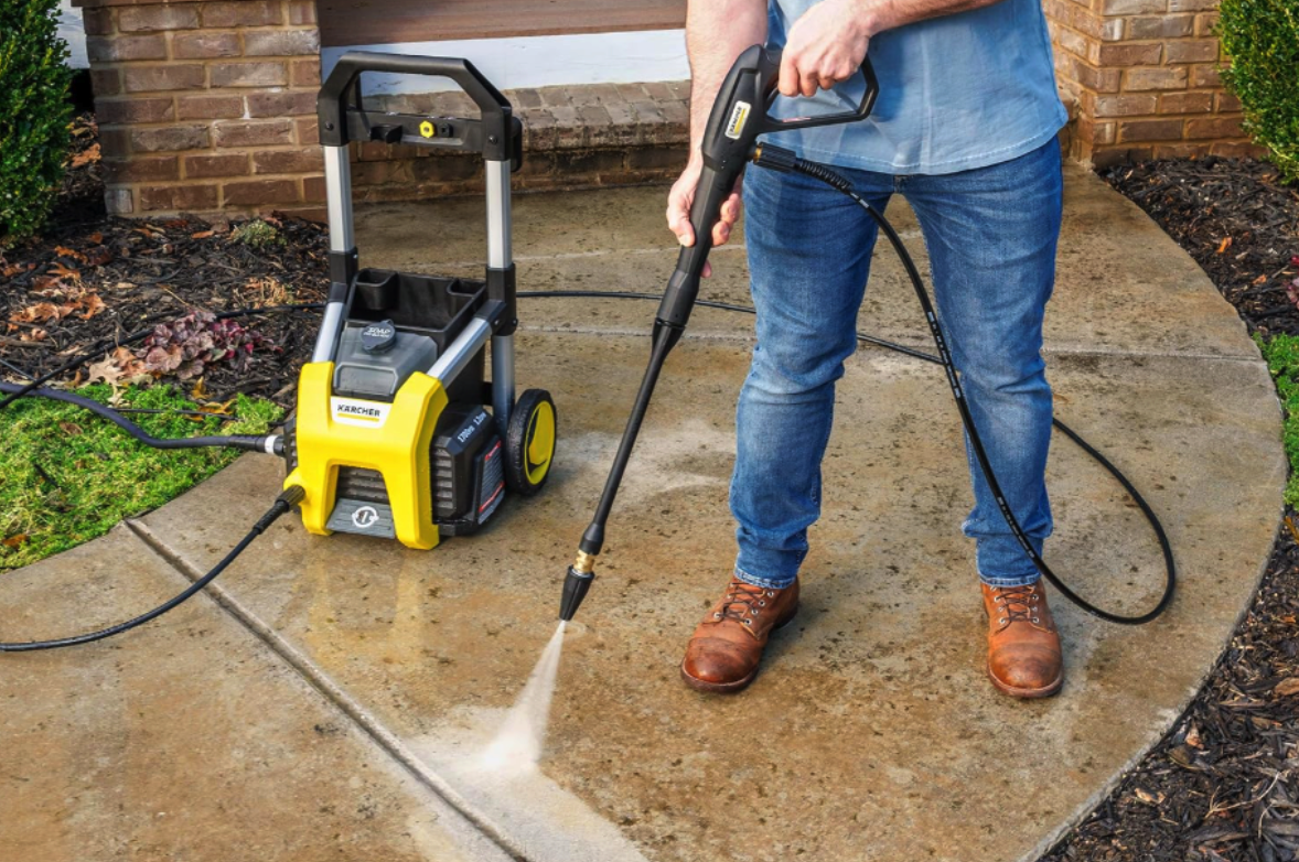 Karcher pressure washer being used on sidewalk