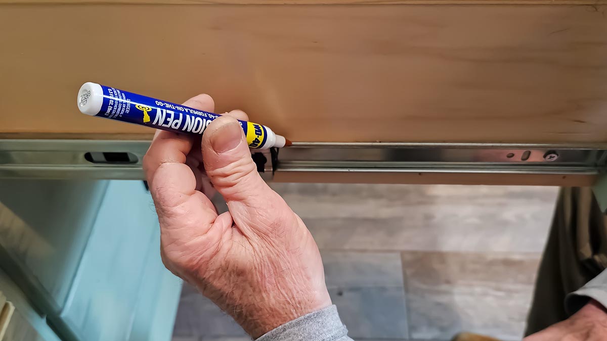 WD-40 Pen Review Lubricating a drawer slide for smooth movement