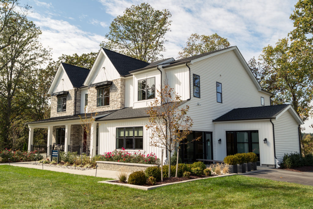 White and tan modern farmhouse style home.